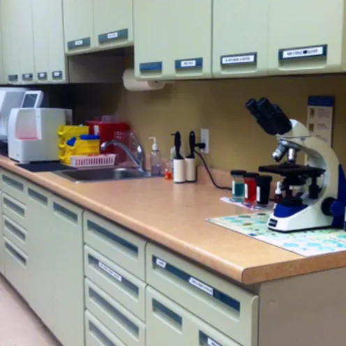 Laboratory room with microscope and mixers